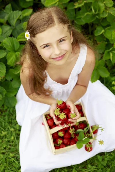 Strawberry time - young girl with picked strawberries — Stock Photo, Image