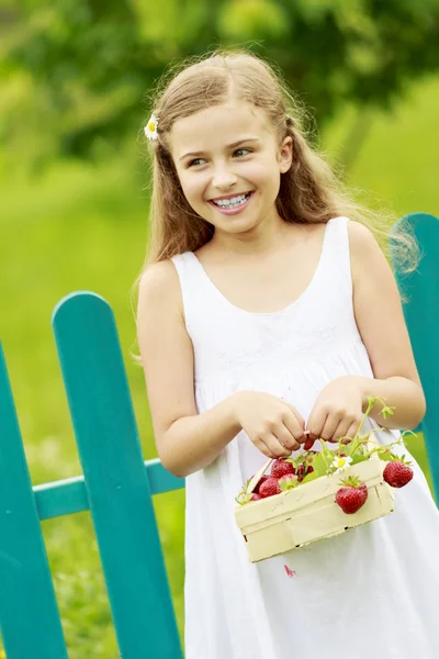 Strawberry time - young girl with picked strawberries — Stock Photo, Image