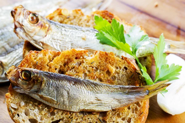 Fish, Spanish tapas - sprat on baked bread — Stock Photo, Image