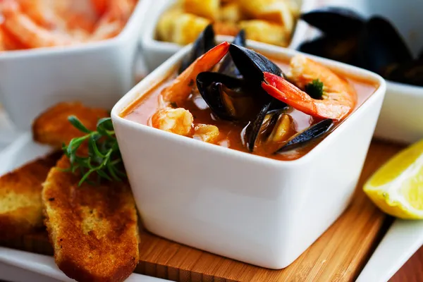 Fish soup - traditional Mediterranean fish soup with mussels and shrimp — Stock Image Fish soup - traditional Mediterranean fish soup with mussels and shrimp Royalty Free Stock Photos