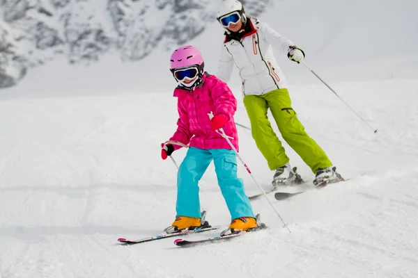 Skiing, skiers on ski run - child skiing downhill, ski lesson — Stock Photo, Image