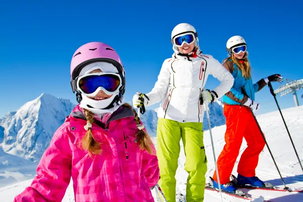 Skiing, winter fun - happy skiers on ski holiday — Stock Photo, Image