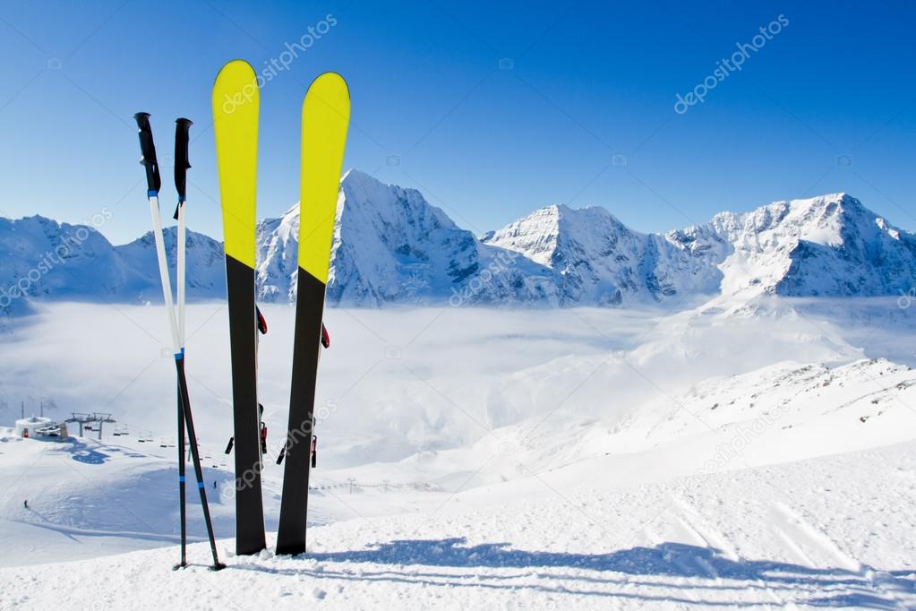 Ski, skiing, winter season , mountains and ski equipment on ski run