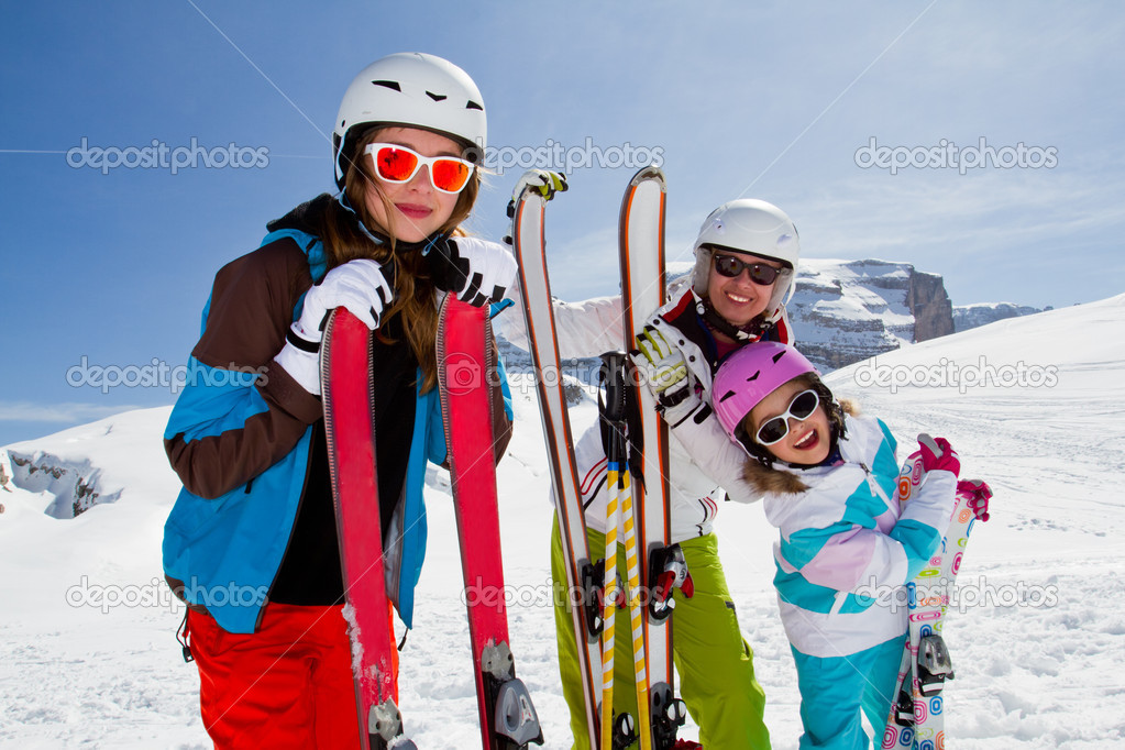 Ski, winter, snow, skiers, sun and fun - family enjoying winter