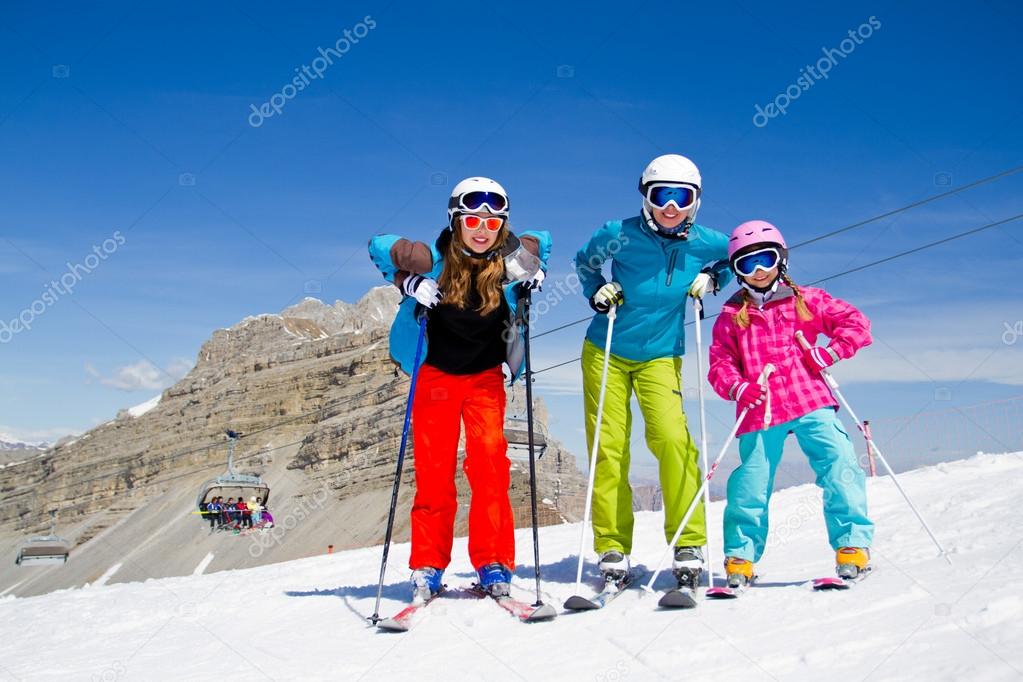 Ski, winter, snow, skiers, sun and fun - family enjoying winter