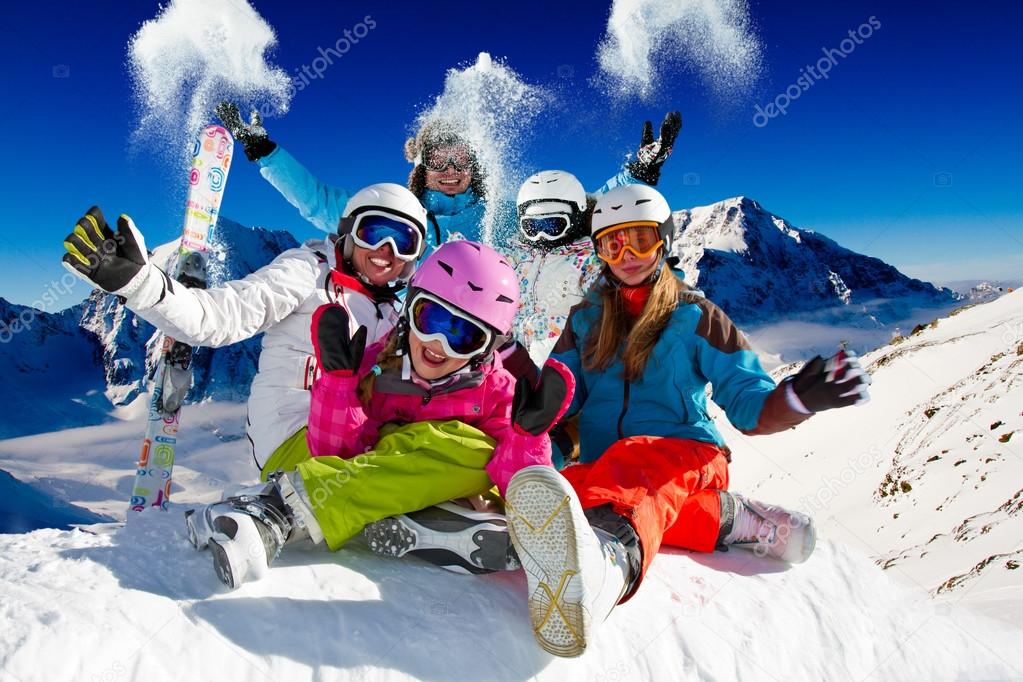 Ski, snow and winter fun - happy family ski team