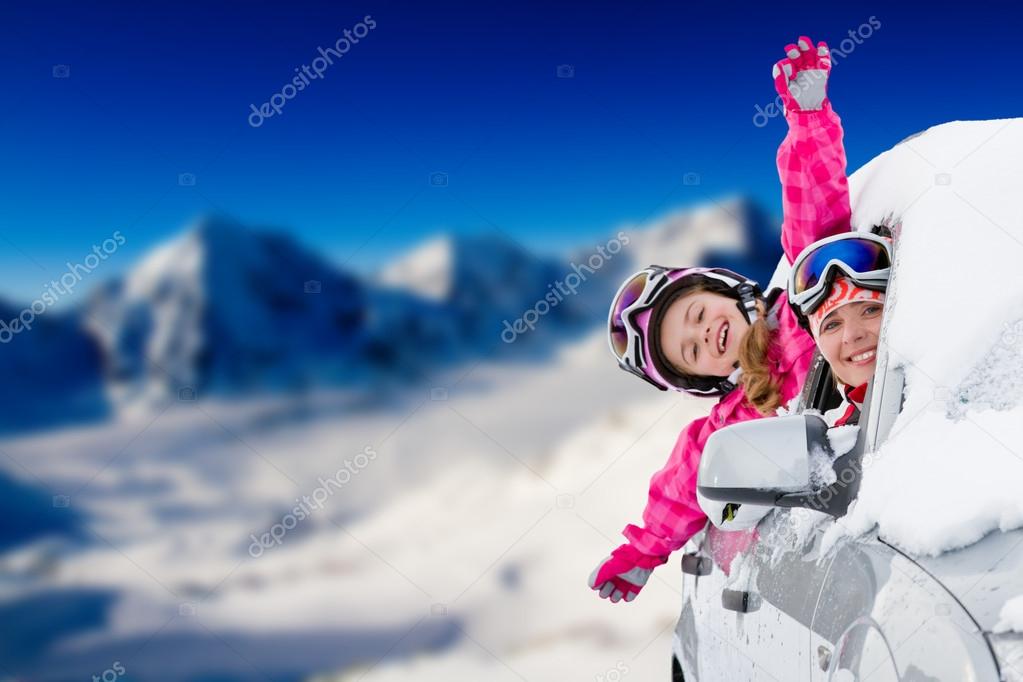 Winter, ski - happy family on the road for ski holidays