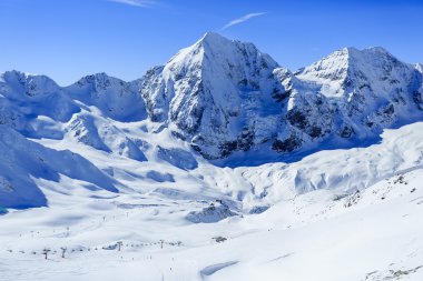 Winter mountains, ski run in Italian Alps