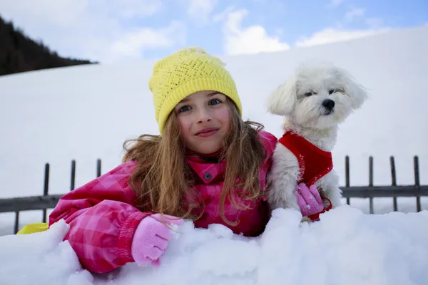 Winter, child, snow - young girl with dog enjoying winter — Stock Photo, Image