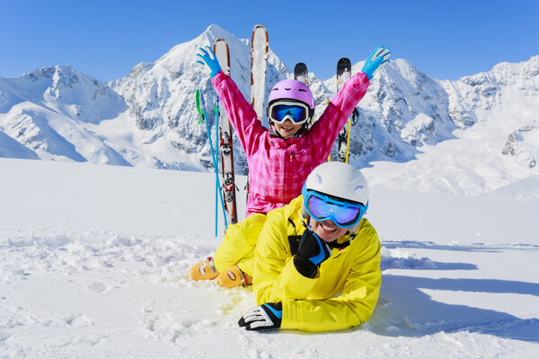 Skiing, winter, snow, sun and fun - family enjoying winter