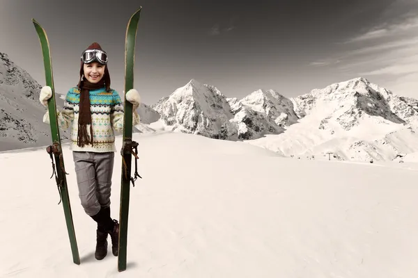 Skiing, winter vacation - girl with retro ski equipment — Stock Photo, Image