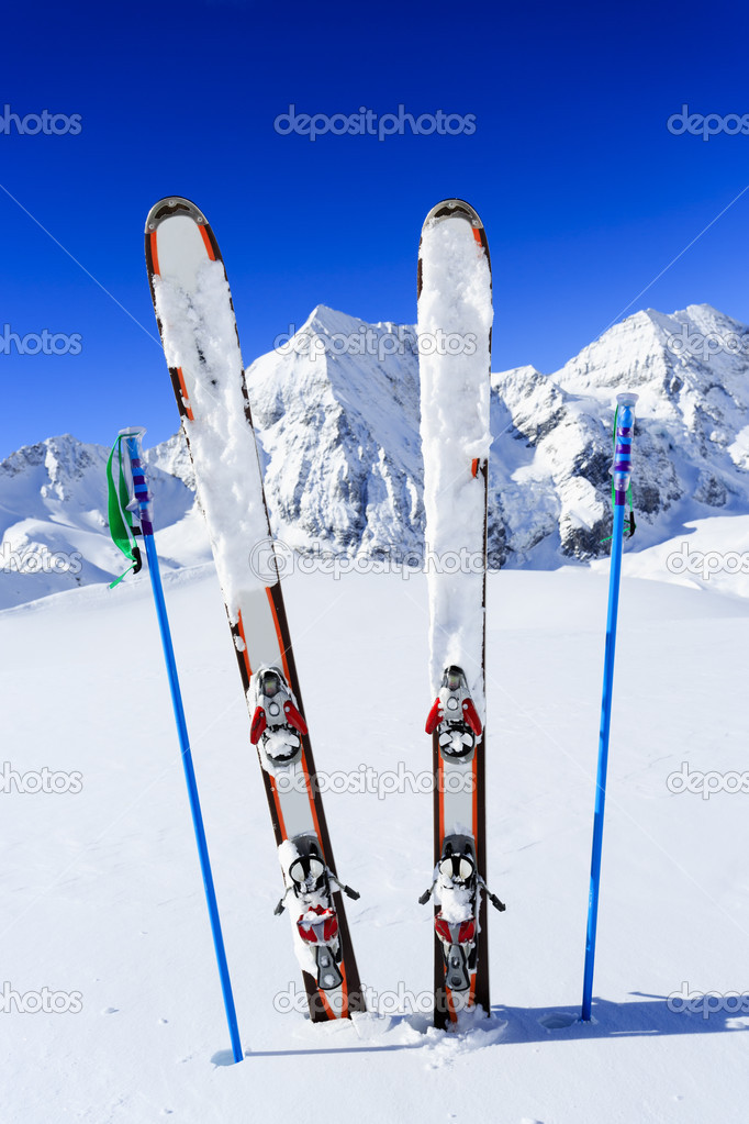 Skiing, winter season , mountains and ski equipments on ski run