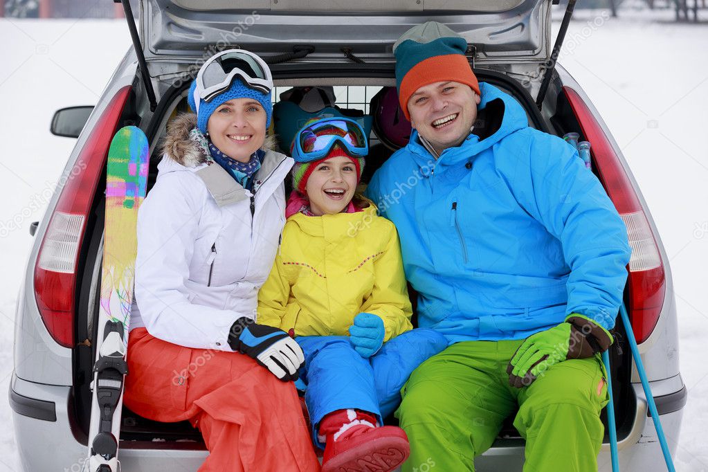 Winter, skiing, journey - family with ski equipment