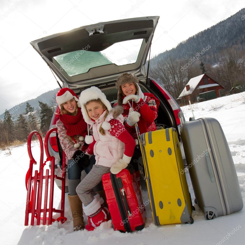 Winter, travel - family with baggage ready for the travel for winter vacation