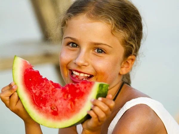 Summer joy, lovely girl eating fresh watermelon on the beach — Stock Photo, Image