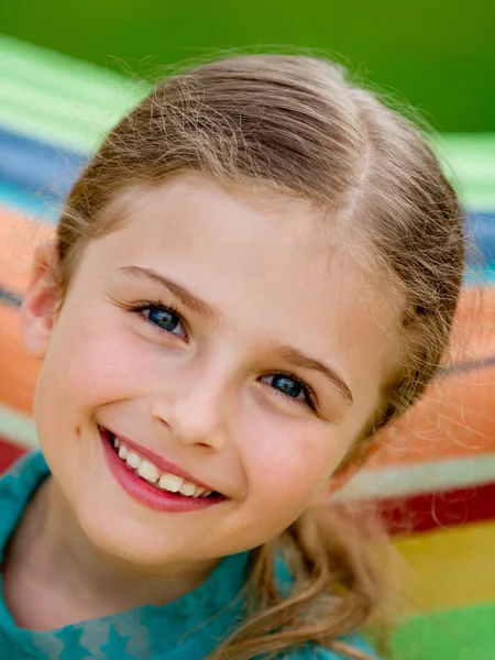 Summer, rest in the garden - lovely girl in colorful hammock — Stock Photo, Image