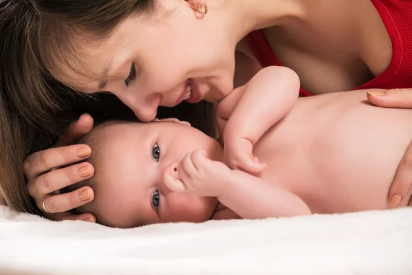 Cheerful young mother and her son — Stock Photo, Image