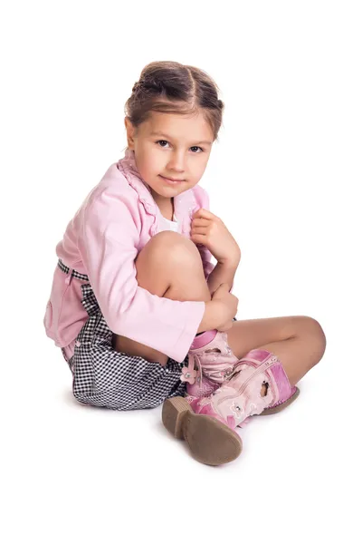 Little girl sitting on the floor — Stock Photo, Image