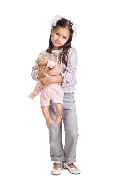 The small beautiful girl with a doll — Stock Photo, Image