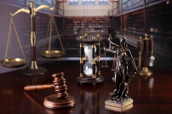 Law theme. Court library - gavel of the judge, Themis sculpture, scale and books.