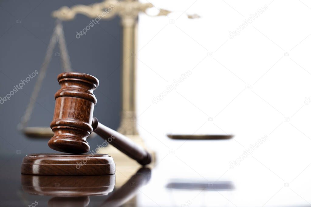 Law symbols composition. Law and justice concept.  Gavel and scale on gray background.