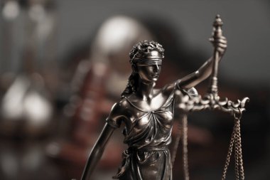 Law and justice concept. Justice symbol - Themis sculpture on gray background.