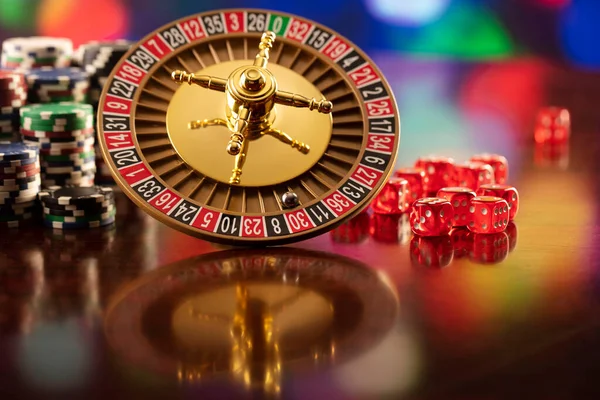 Casino Roulette Wheel Dice Poker Chips Colorful Bokeh Background — Stock Photo, Image