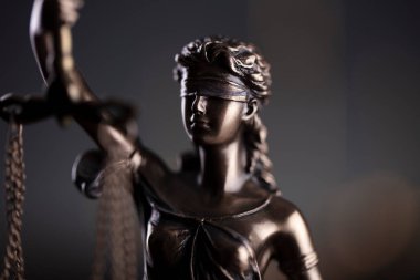  Law and justice concept. Law symbols composition. Themis sculpture and judges gavel on gray background.
