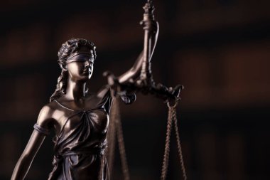  Law and justice concept. Law symbols composition. Themis sculpture and judges gavel on gray background.