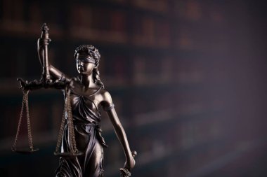  Law and justice concept. Law symbols composition. Themis sculpture and judges gavel on gray background.