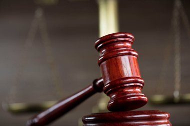 Law theme - judge office. Gavel and legal books on the judge desk. 