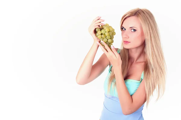 Girl with a bunch of grapes — Stock Photo, Image