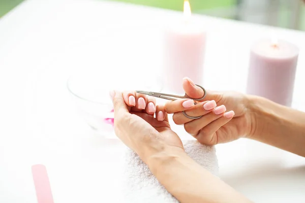 Closeup of beautiful woman hands getting manicure at home — Stock Photo, Image