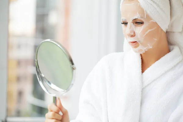 Beautiful Woman Applying Paper Sheet Mask On Her Face White — Stock Photo, Image