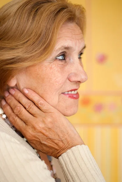 Sympothetic old lady is resting at home — Stock Photo, Image