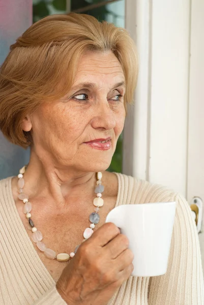 Dreaming older woman resting — Stock Photo, Image
