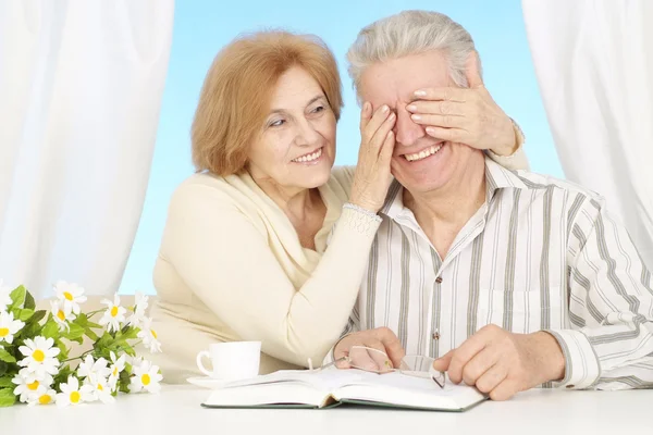 Playful elderly couple resting at home — Stock Photo, Image
