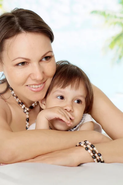 Fine woman with daughter at the resort — Stock Photo, Image