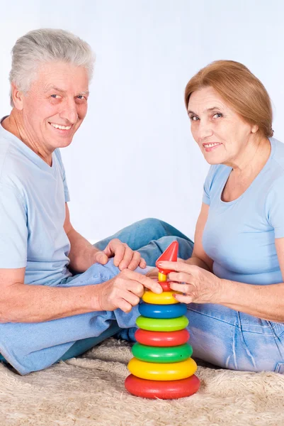 Old couple on carpet — Stock Photo, Image