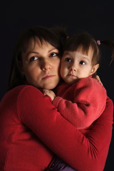 Beautiful sad Caucasian woman with a daughter — Stock Photo, Image