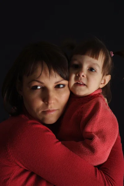Beautiful sad Caucasian mother with a daughter — Stock Photo, Image