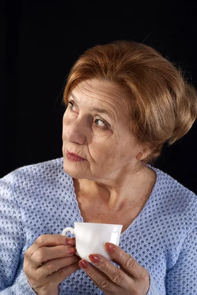 Beautiful aged female sitting — Stock Photo, Image