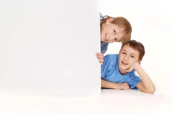 Two Caucasian guys in blue shirts are the tablet — Stock Photo, Image