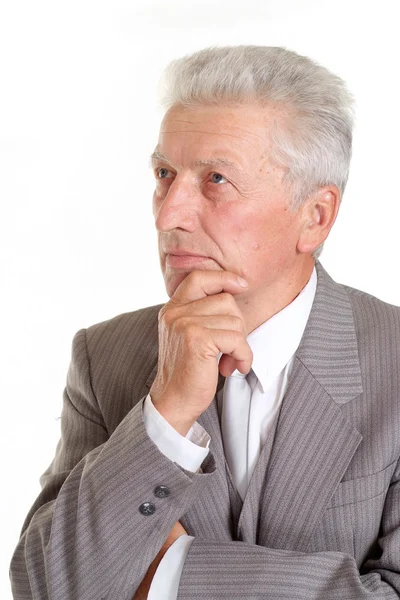 Thoughtful elderly man in suit — Stock Photo, Image