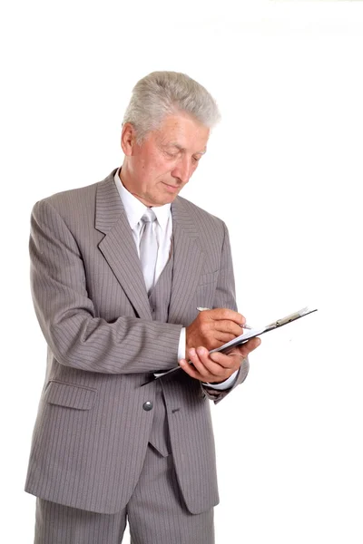 Writing elderly man in suit — Stock Photo, Image