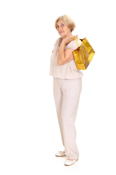 Bella vecchia donna con lo shopping — Foto Stock