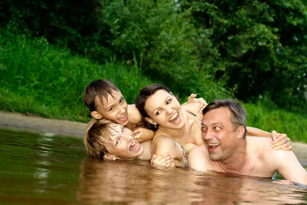 Good family having fun on the river — Stock Photo, Image