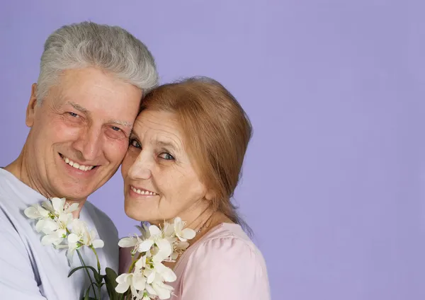 Happy Caucasian elderly stand together with the flower — Stock Photo, Image