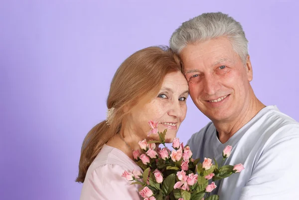 Happy Caucasian elderly stand together with the flower — Stock Photo, Image