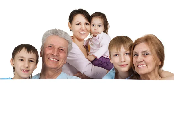 Happy Caucasian family of six holding the paper — Stock Photo, Image